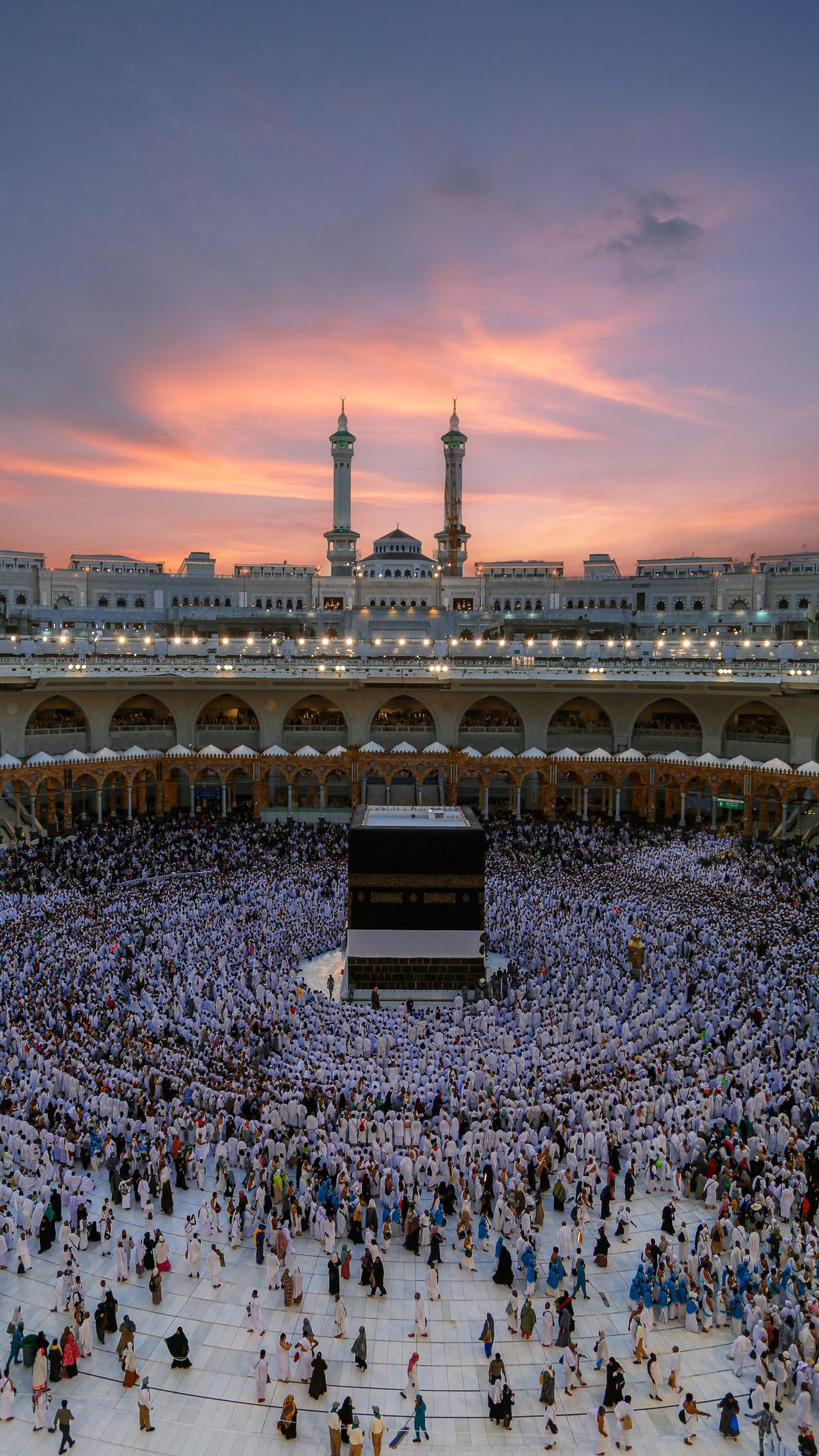 Pilgrims around the Kaaba at sunset